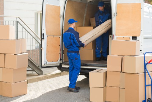 Same day removals team working in Blackfriars with moving van and boxes