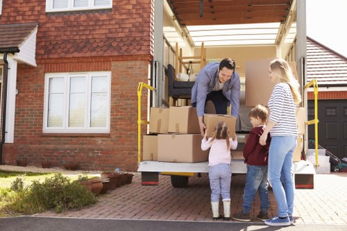 Organised moving day setup with labelled boxes and furniture in a Blackfriars home