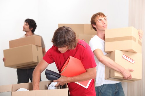 Packed moving boxes and furniture prepared for a Blackfriars home relocation